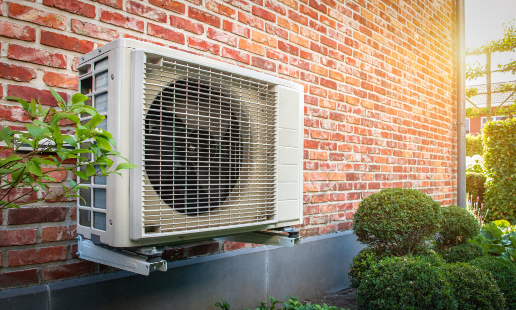 Mounted heat pump on brick home