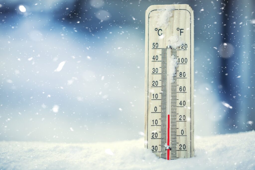 freezing thermometer in the snow at 30 degrees fahrenheit