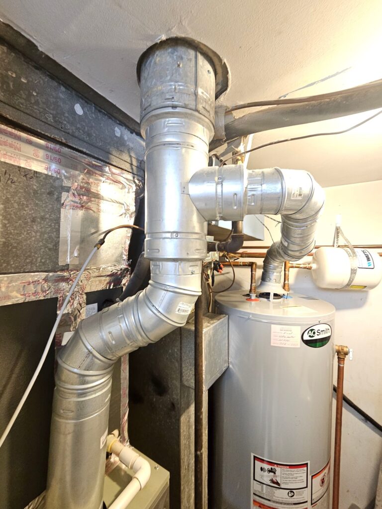 water heater in a Sterling, VA basement before tankless water heater installation