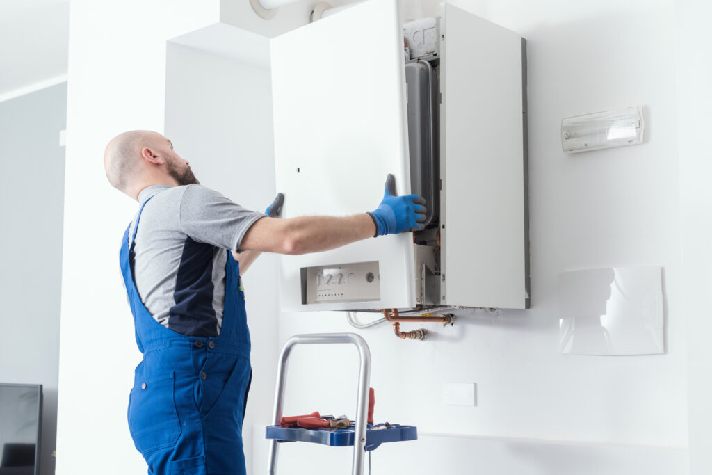 HVAC technician installing a boiler