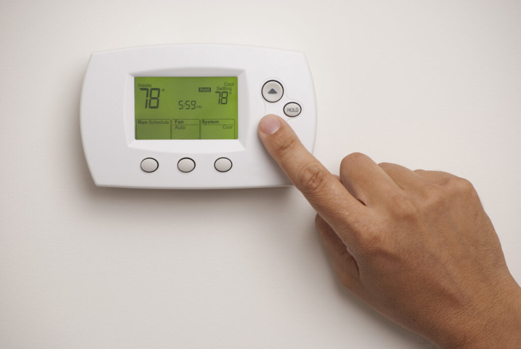 Closeup of programmable thermostat set to 78 degrees